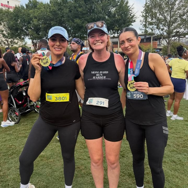 Queen City Mother Runners with race medals