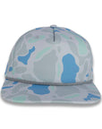 front view of gray and blue camouflage baseball cap on a gray background