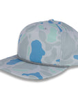 three-quarter view of gray and blue camouflage baseball cap on a gray background