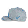 left side view of gray and blue camouflage baseball cap on a gray background