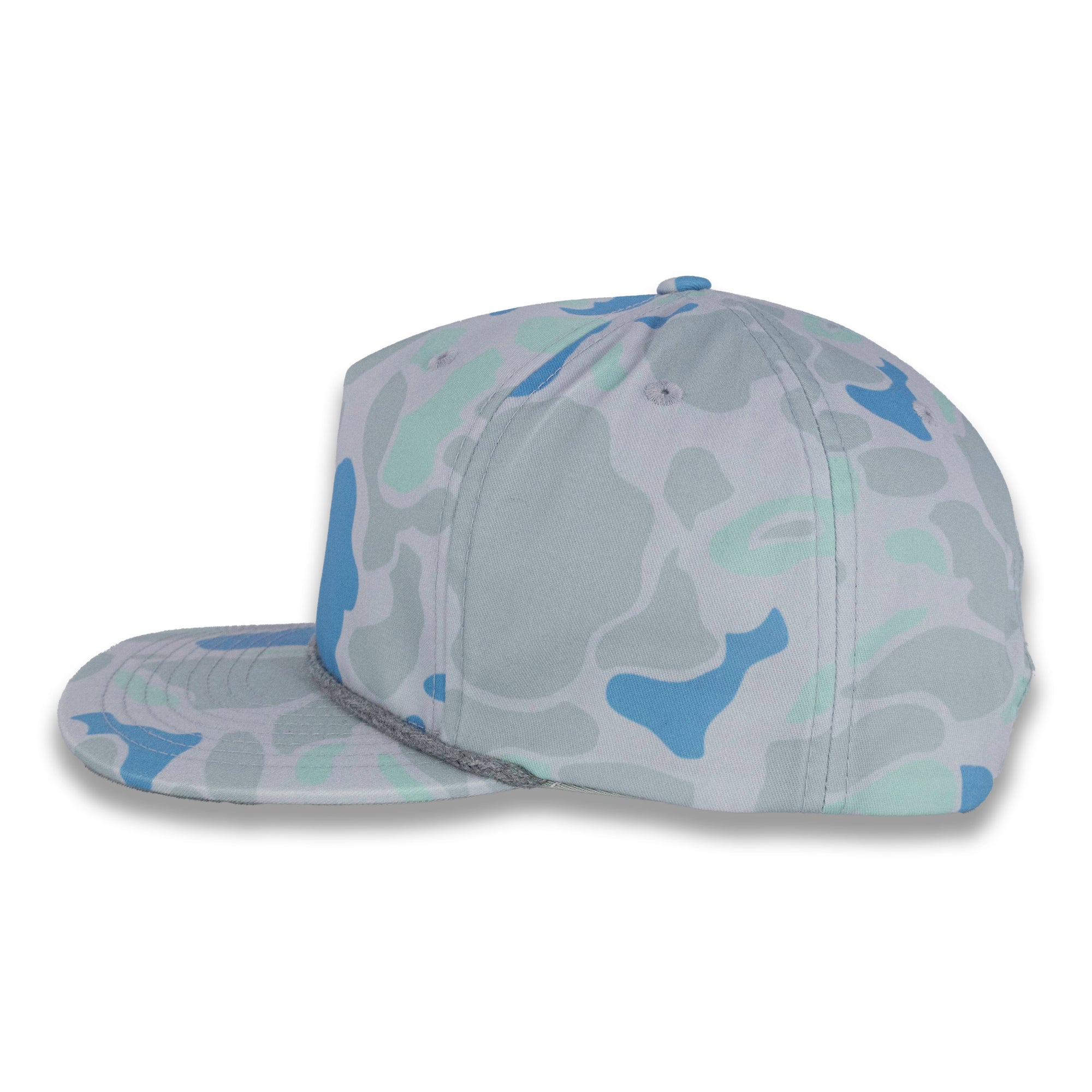 left side view of gray and blue camouflage baseball cap on a gray background
