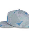 left side view of gray and blue camouflage baseball cap on a gray background