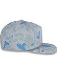 right side view of gray and blue camouflage baseball cap on a gray background