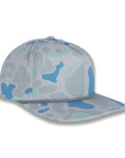 three-quarter view of gray and blue camouflage baseball cap on a gray background