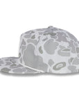 side view of gray camouflage baseball cap on a white background