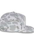 right side view of gray camouflage baseball cap on a white background